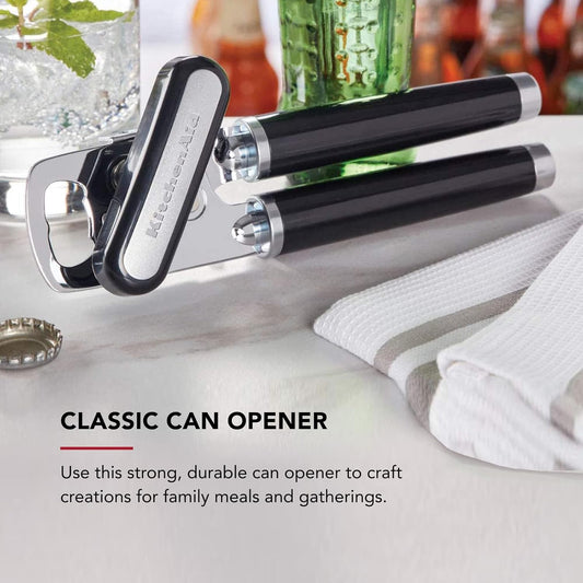 Classic black can and bottle opener with stainless steel cutting wheel on a countertop.