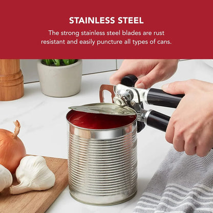Hands using black-handled stainless steel can opener on an opened tin can with tomato sauce