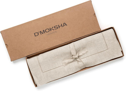 Open box with a beige napkin and 'D'Moksha Homes' branding on a white background