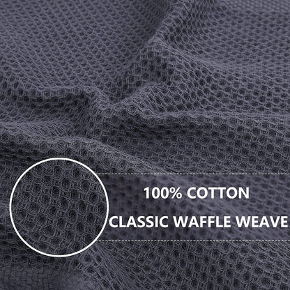 Close-up of the dark grey waffle weave texture on a cotton kitchen dish cloth.
