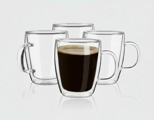 Set of four clear double wall glass coffee mugs, one filled with black coffee, on white background