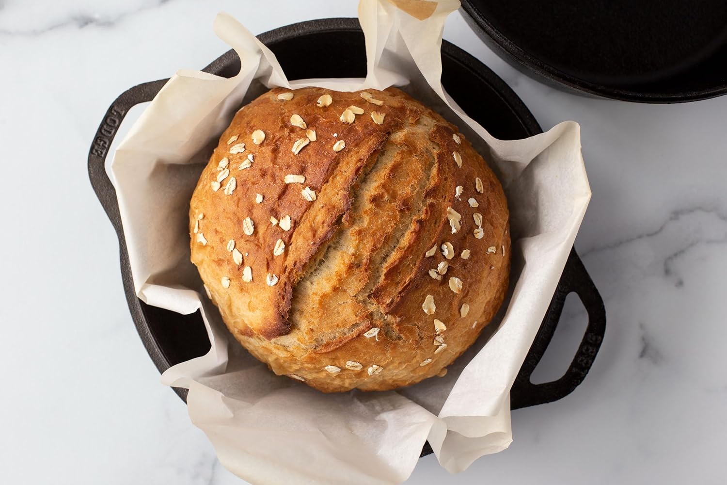 Cast iron double Dutch oven and 10.25 inch skillet lid displayed side by side.