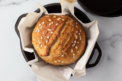 Cast iron double Dutch oven and 10.25 inch skillet lid displayed side by side.