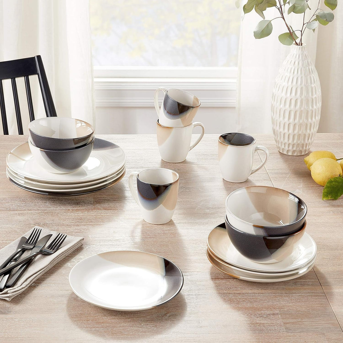 mikasa-gourmet-basics-caden-16-piece-stoneware-dinnerware-set-service-for-4-white-glossy-center-with-black-and-tan-two-tone-reactive-glaze-dishwasher-and-microwave-safe