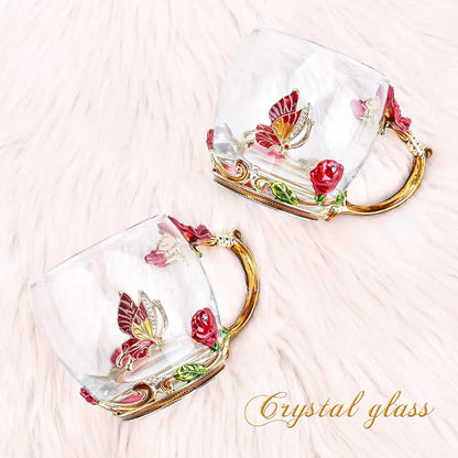 Pair of crystal glass coffee mugs with gold handles, red rose and butterfly decorations
