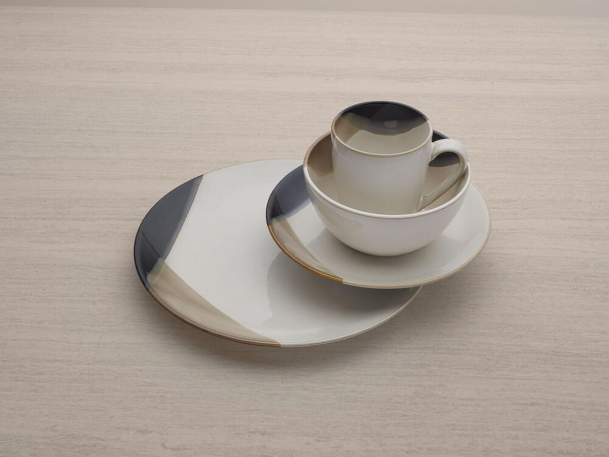 mikasa-gourmet-basics-caden-16-piece-stoneware-dinnerware-set-service-for-4-white-glossy-center-with-black-and-tan-two-tone-reactive-glaze-dishwasher-and-microwave-safe