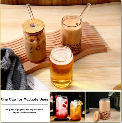 Set of 3 glass tumblers with clear straws, filled with iced coffee, bubble tea, and amber beer on wooden table