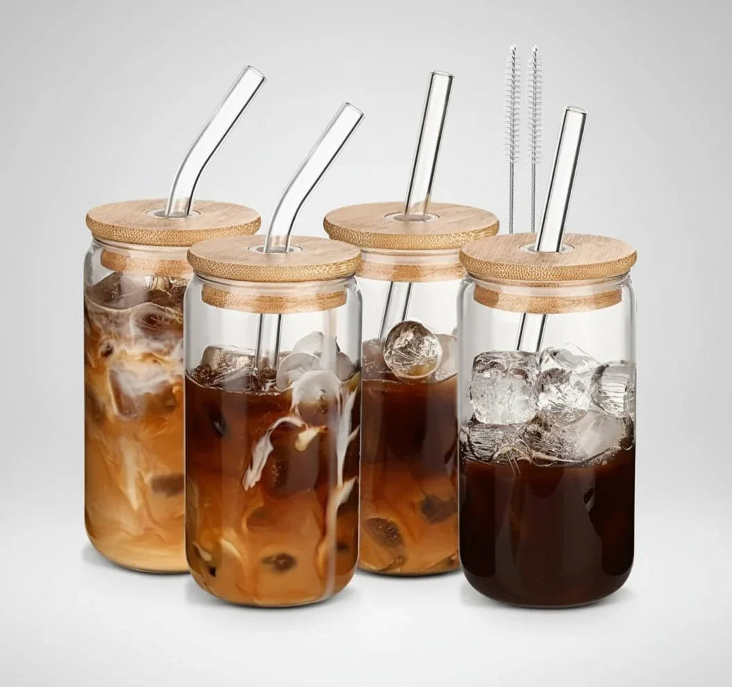 Set of four 16 oz glass iced coffee tumblers with bamboo lids and clear glass straws