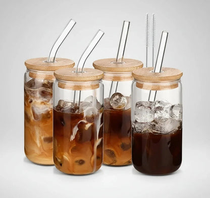 Set of four 16 oz glass iced coffee tumblers with bamboo lids and clear glass straws