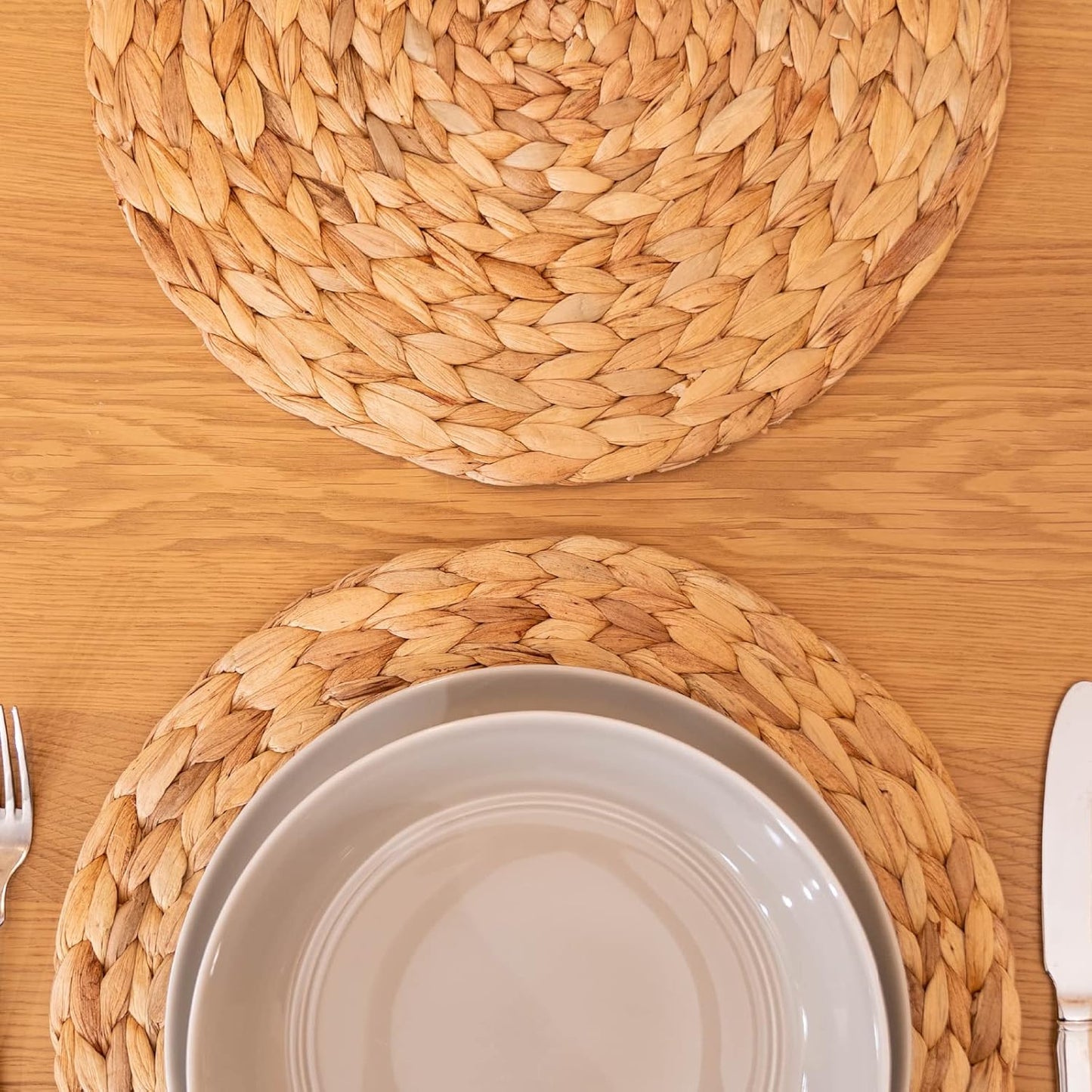 Natural woven placemat used under a hot pot to protect a wooden table.