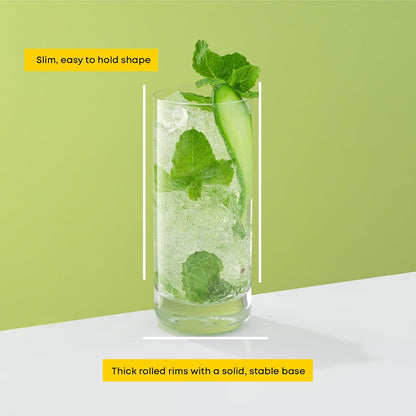 Person holding a Faye highball glass by its slim, comfortable grip.