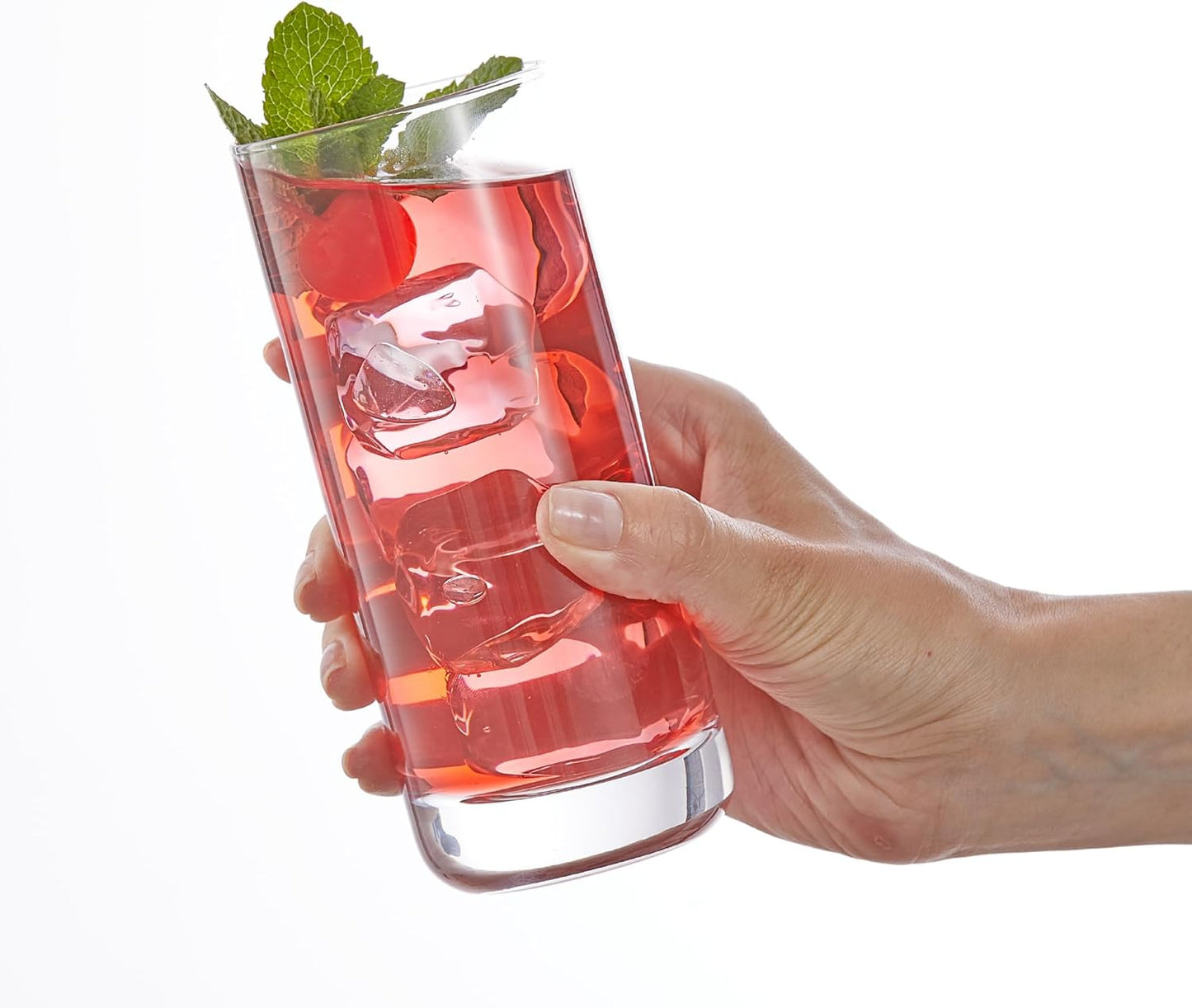 Lead-free crystal highball glasses with colorful mixed drink cocktails on a bar.