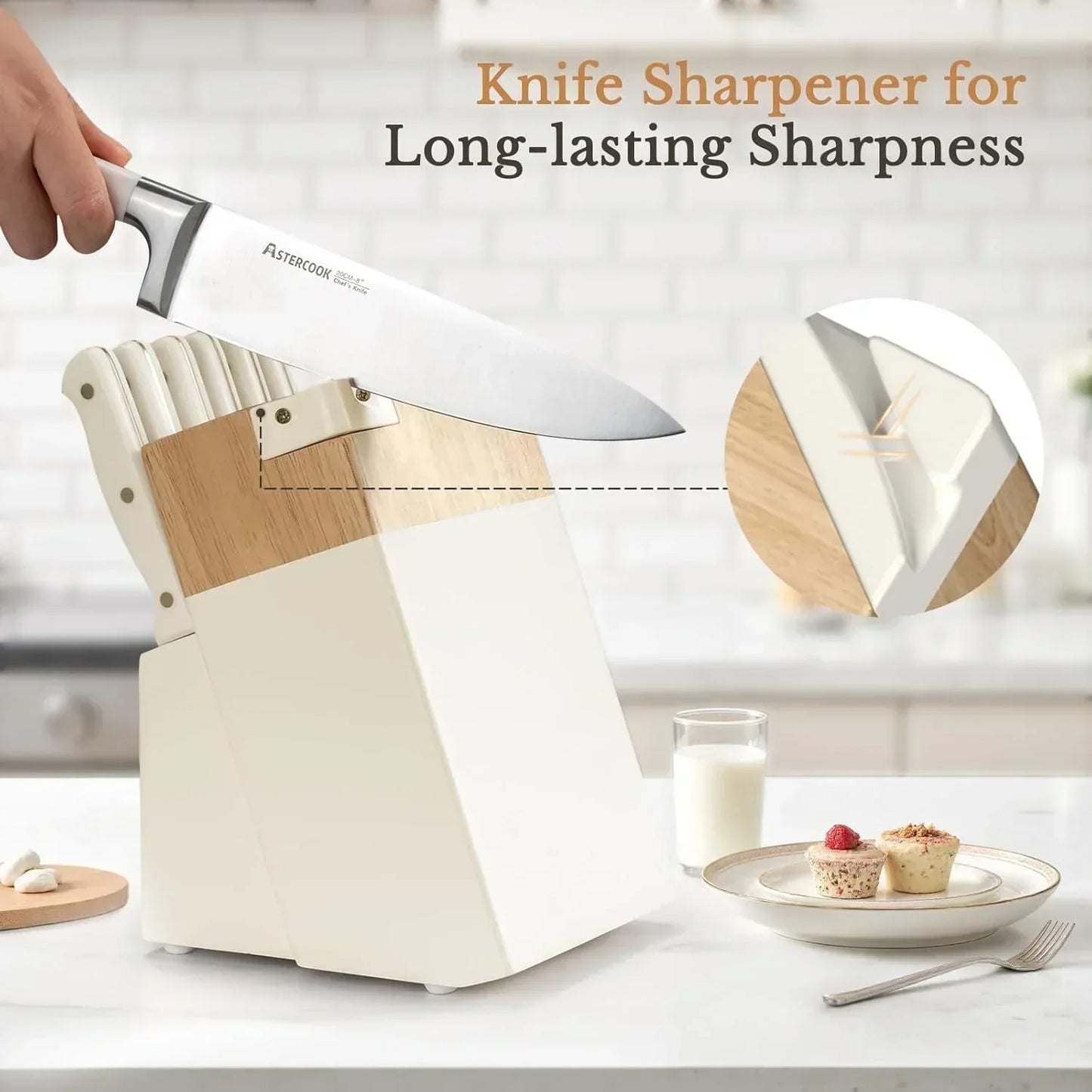 Hand using AsterCook chef's knife to sharpen in cream white wooden knife block with built-in sharpener on kitchen counter