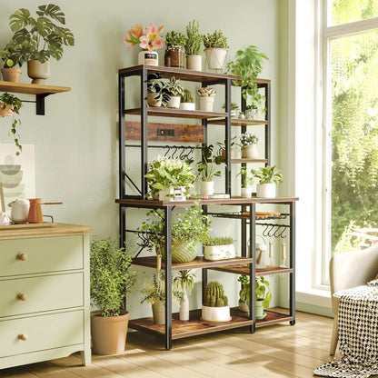 6-tier rustic brown bakers rack with black metal frame and built-in power outlets, holding potted plants and kitchen tools