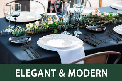 Detail shot of mirror-finished black flatware reflecting light on the surface