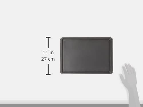 Nonstick baking sheet filled with freshly baked cookies sliding easily off the pan.