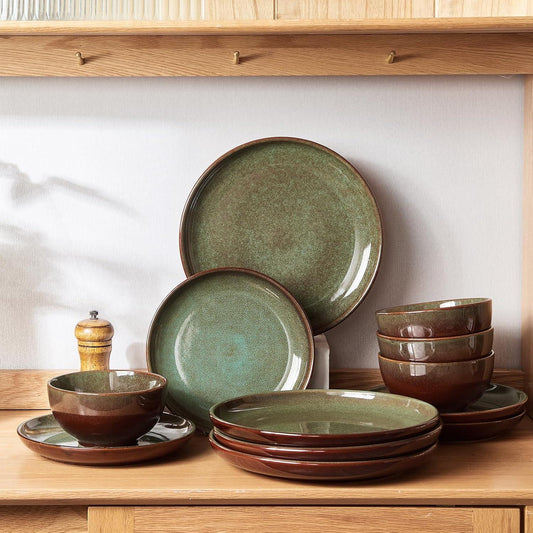 12-piece reactive glaze stoneware dinnerware set in green and brown on wooden shelf