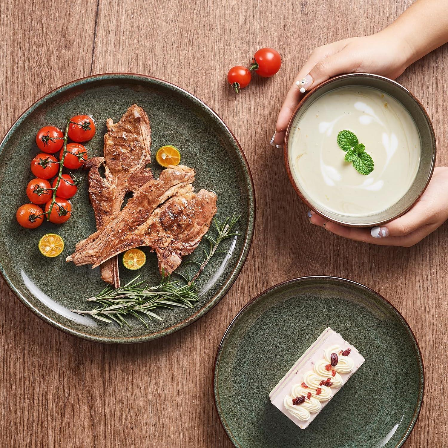 Green reactive glaze stoneware plates with grilled meat, cherry tomatoes, rosemary, dessert, and cream soup