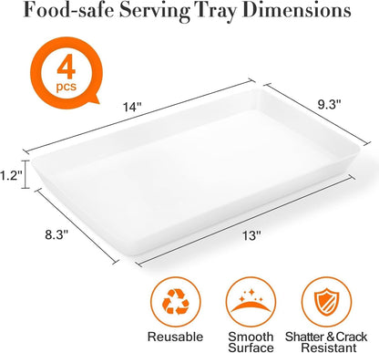 Plastic serving trays filled with snacks and fresh fruit on a kitchen counter.