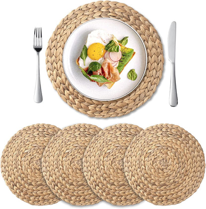 Set of four round 13.8 inch natural water hyacinth placemats arranged on a table.