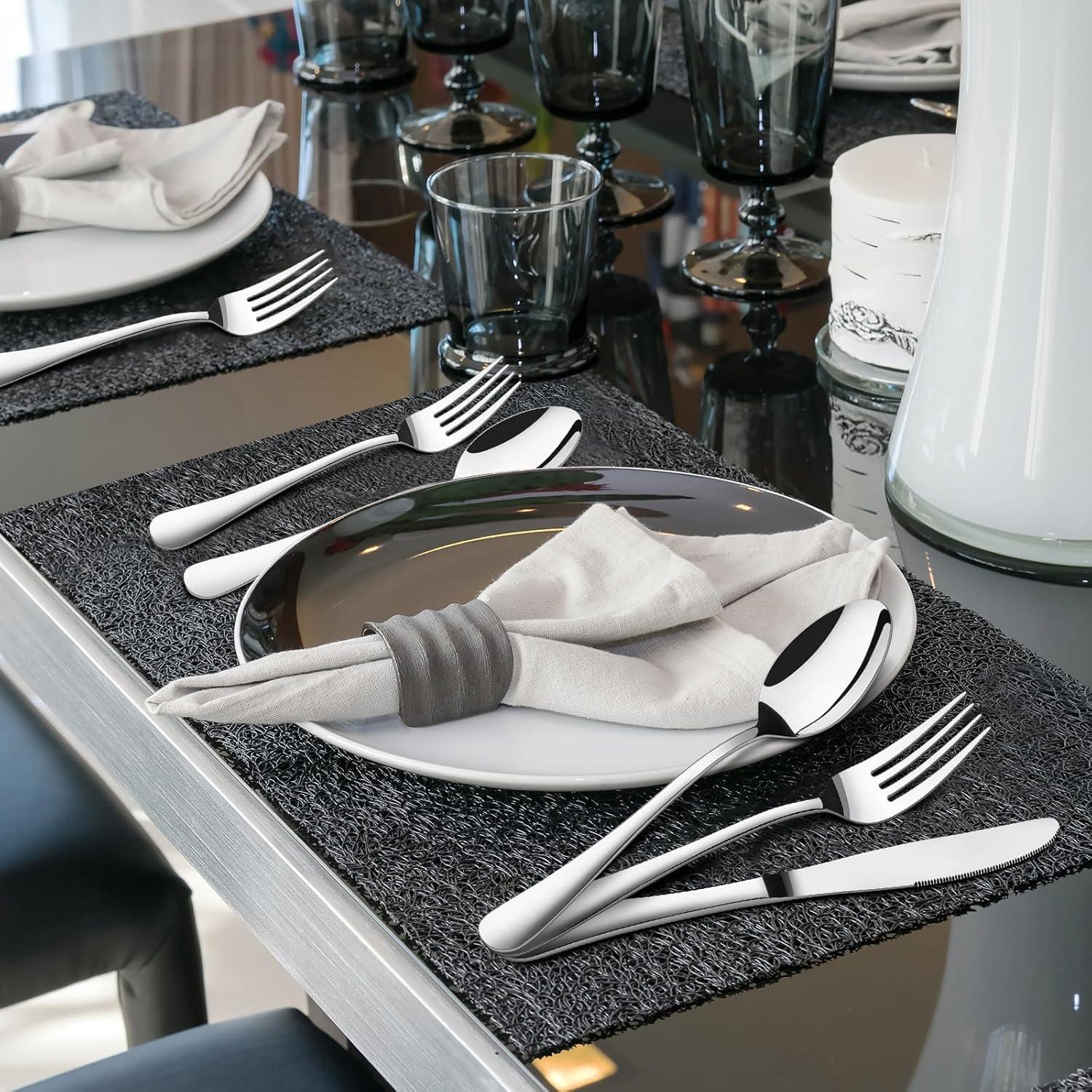 Modern dining table setting with 40-piece heavy duty stainless steel flatware set and gray napkin