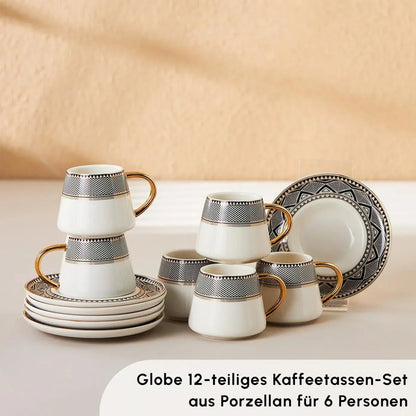 Set of six white porcelain Turkish coffee cups with black geometric bands and gold handles, stacked on matching saucers