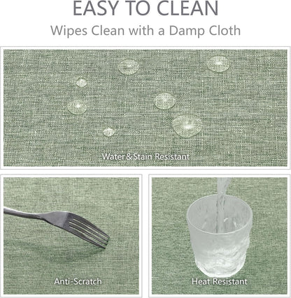 Water droplets beading on the surface of the waterproof sage green tablecloth.