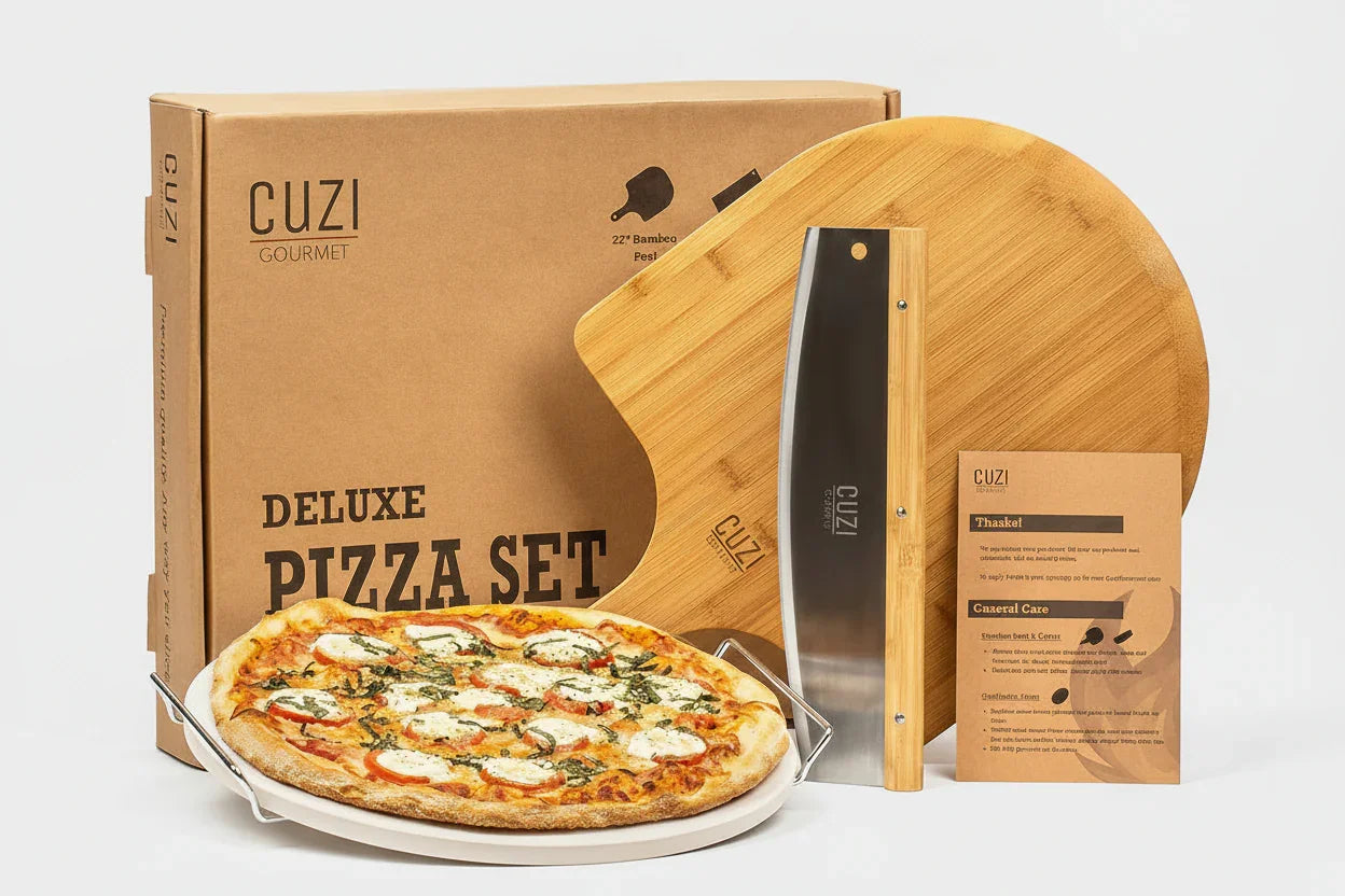 Cuzi Gourmet deluxe pizza set with 15-inch pizza stone, bamboo peel, rocker cutter, and box